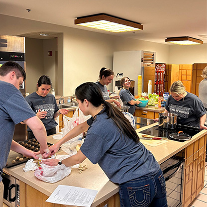 Image of associates making food